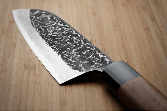 Damascus Steel простирается в лезвие на полном ножке?